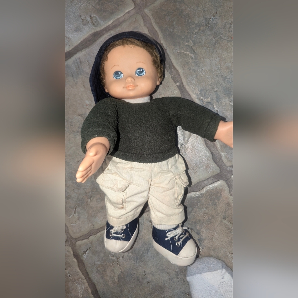 Adorable Doll with Black Sweater and Cream Pants